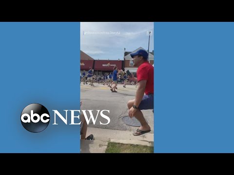 You are currently viewing Gunfire sends spectators fleeing at 4th of July parade