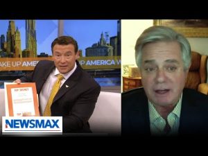 Read more about the article WATCH: Newsmax host reveals folder marked ‘Top Secret’ | ‘Wake Up America’