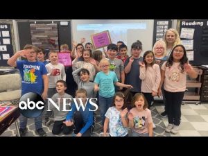 Read more about the article 2nd graders celebrate classmate’s adoption with matching signs,t-shirts