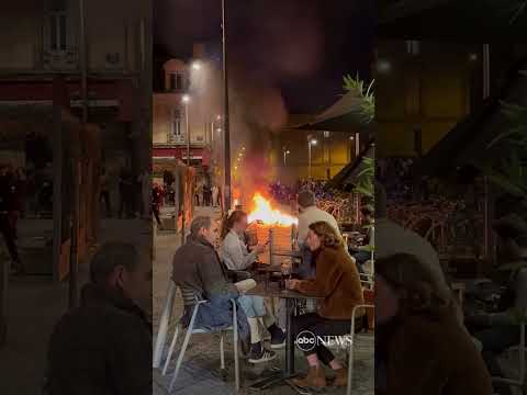 You are currently viewing French diners enjoy wine as fire lit by protesters burns nearby | ABC News