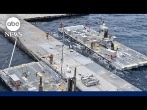 Read more about the article Humanitarian aid trucks move into Gaza through temporary pier built by US military