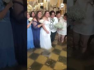 Read more about the article Couple walks down flooded aisle on their wedding day in Philippines