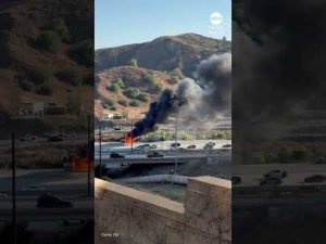 Read more about the article Smoke billows after semi-truck carrying Teslas catches fire