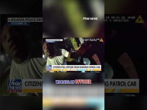 Read more about the article SEE IT: Bystanders pull police officer from burning patrol car #shorts #foxnews #us #news