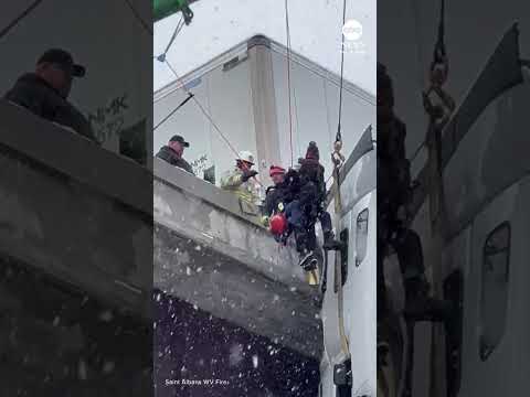 You are currently viewing Truck driver rescued from tractor-trailer hanging off bridge in West Virginia