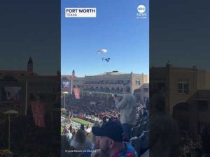Read more about the article Parachutist tumbles to ground during football game entertainment