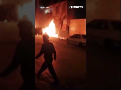 You are currently viewing FUELED BY FURY: Chaos erupts in Iran as protesters overturn a car and set fires #shorts #world #news