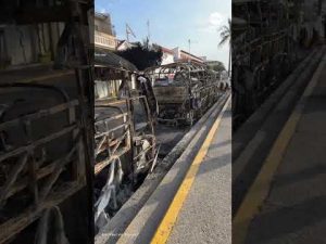 Read more about the article Burnt-out buses cleared from street after cartel violence in Mexico