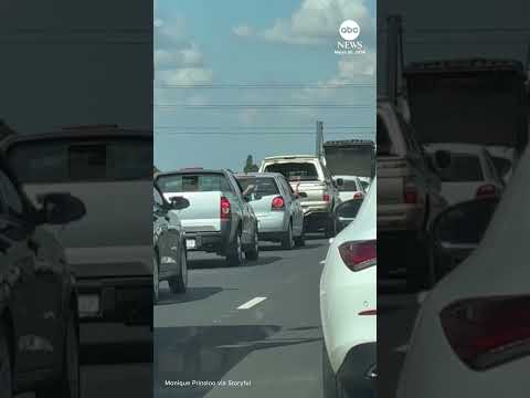 You are currently viewing Drivers pass time in traffic jam with game of rock, paper, scissors