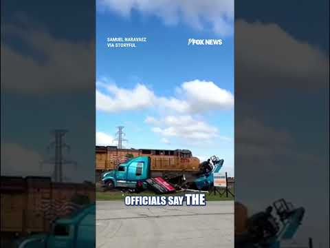 You are currently viewing WATCH: Trucker NARROWLY escapes freight train CRASH #shorts #us #viral #crash