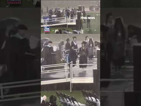 You are currently viewing GRADUATION GOES ON: Ceremony continues despite torrential downpour #foxnews #news #shorts