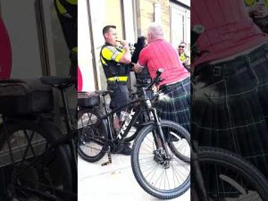 Read more about the article Boston police officer attempts bagpipes for Scottish World Cup fans