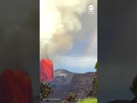 Read more about the article Erupting volcano and rainbow share sky in Hawaii