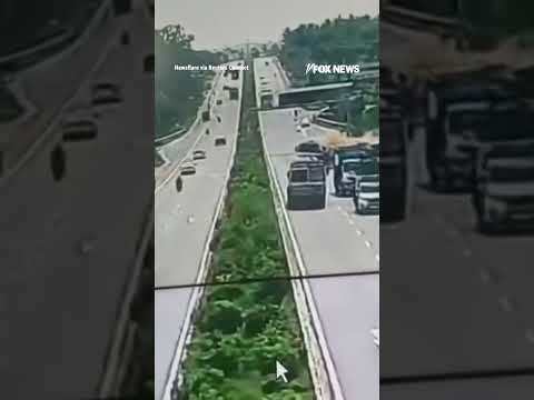 Read more about the article Surveillance video shows truck losing control after slamming into tractor