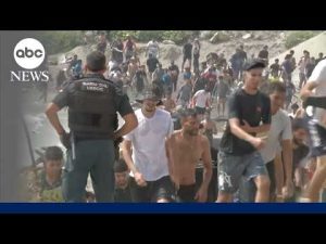 Read more about the article Thousands of migrants surge into Spanish enclave in North Africa