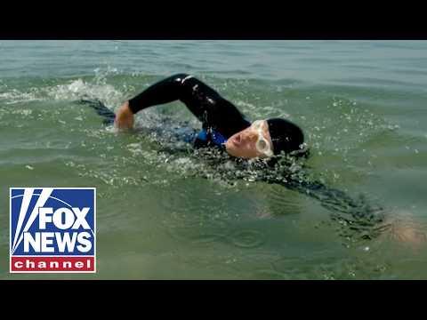 Read more about the article SWIMMING FOR AMERICA’S HEROES: Towing 250 cannonballs across Lake Michigan