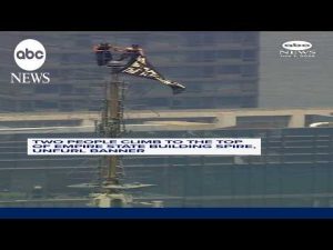 Read more about the article Two people climb to the top of Empire State Building spire, unfurl banner
