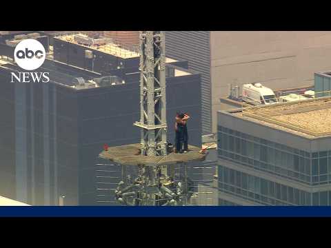 Read more about the article Masked climbers get engaged on the spire of the Empire State Building