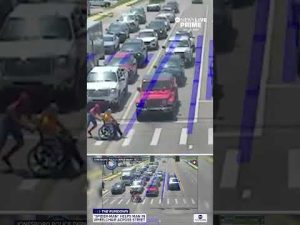 Read more about the article Spider-man helps man in wheelchair cross the street