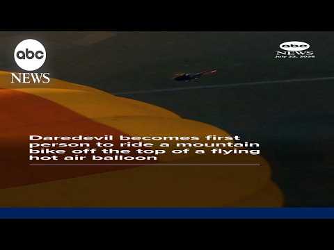 Read more about the article Daredevil rides bike off flying hot air balloon