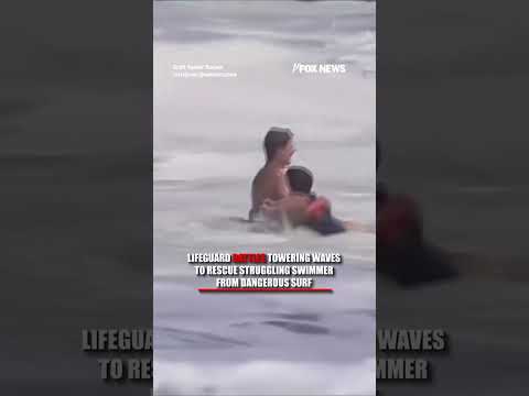 Read more about the article Lifeguard battles TOWERING waves to rescue struggling swimmer #shorts #us #news #foxnews #viral