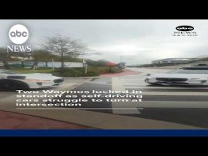 Read more about the article Waymos locked in standoff after self-driving cars struggle to turn at intersection