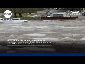 Read more about the article Snowplow clears road after hailstorm in Colorado